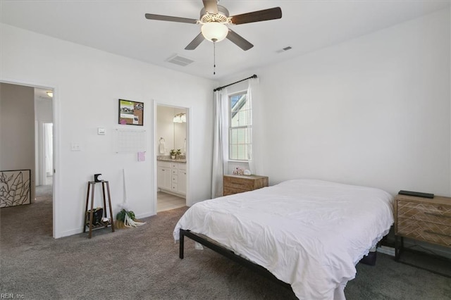 carpeted bedroom featuring ensuite bathroom and ceiling fan