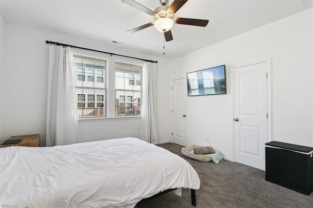 carpeted bedroom featuring ceiling fan