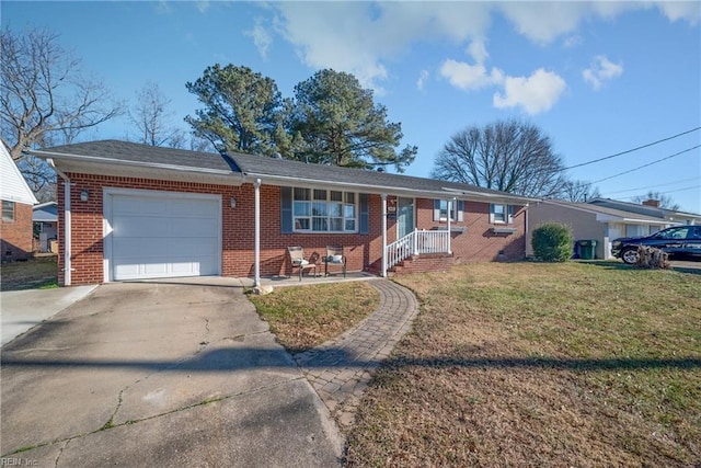 single story home with a front yard and a garage