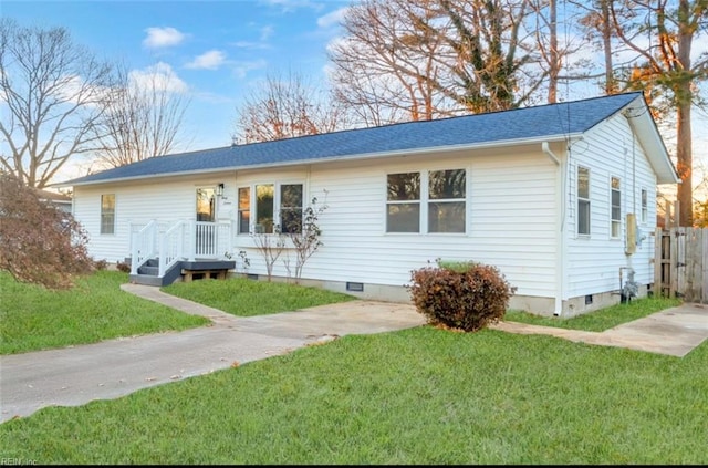 ranch-style home with a front lawn