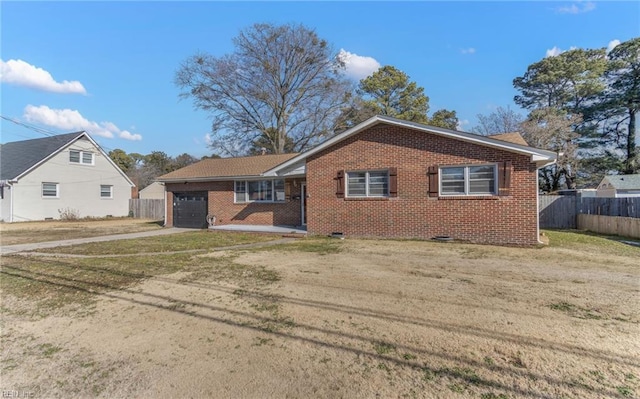 view of front of property featuring a garage and a front yard