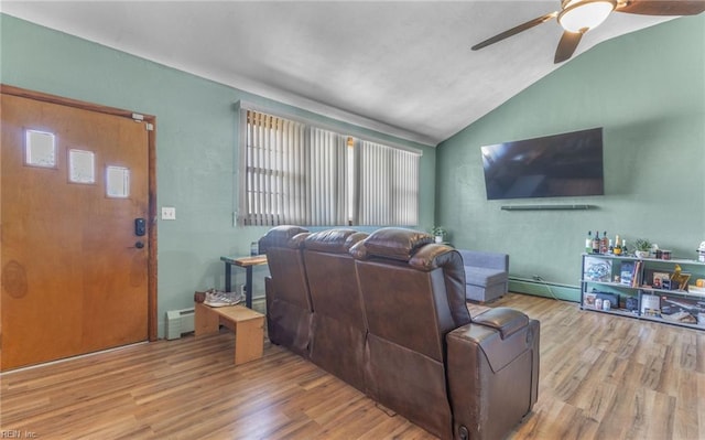 living room featuring lofted ceiling, a baseboard radiator, ceiling fan, and light hardwood / wood-style flooring