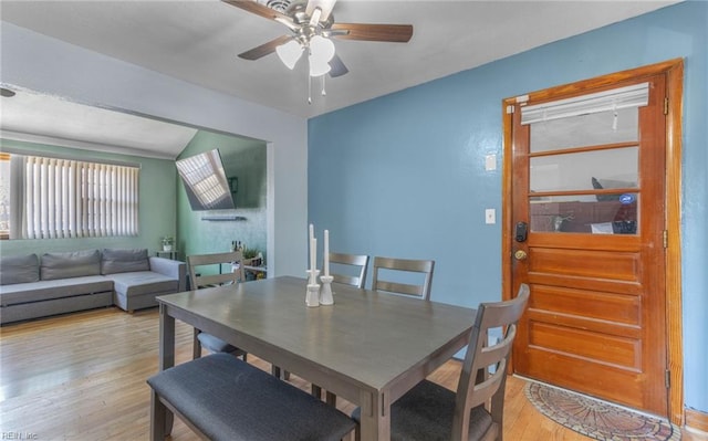 dining area featuring ceiling fan and light hardwood / wood-style flooring