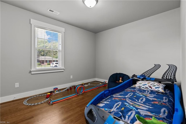 bedroom featuring hardwood / wood-style floors