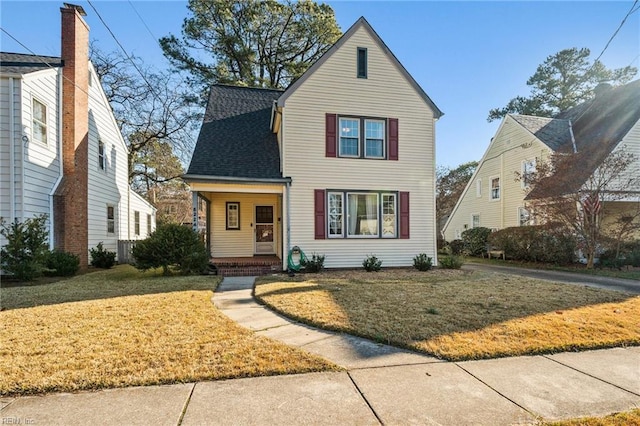 front facade with a front yard