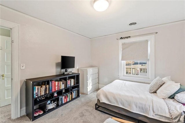 bedroom featuring light carpet