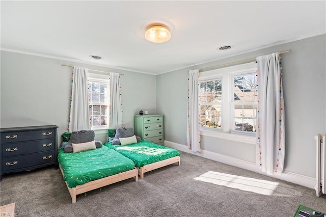 carpeted bedroom featuring radiator, crown molding, and multiple windows