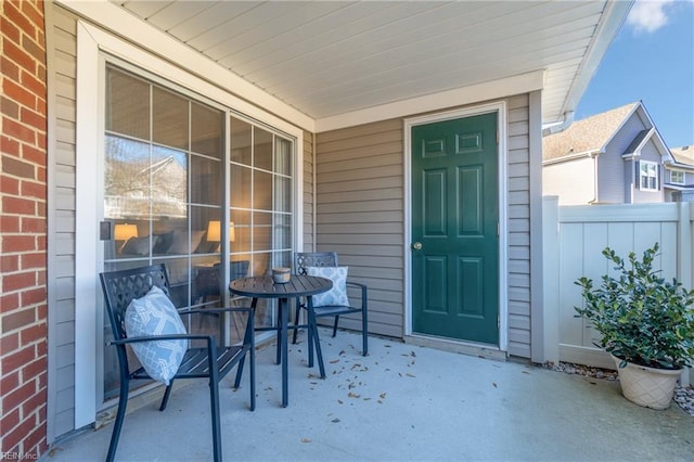 view of exterior entry with a porch