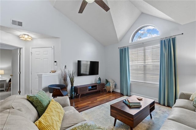 living room with ceiling fan, light wood-type flooring, and lofted ceiling