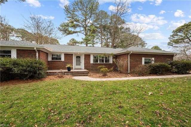 ranch-style house featuring a front lawn