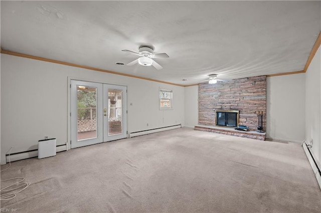 unfurnished living room with a stone fireplace, ornamental molding, light carpet, french doors, and a baseboard radiator