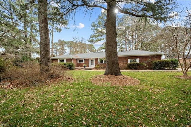 single story home featuring a front yard