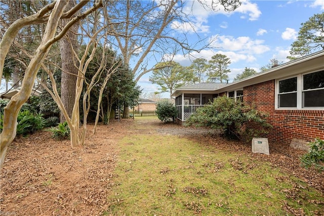 view of yard with a sunroom