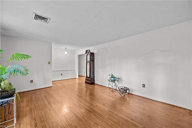 empty room with wood-type flooring