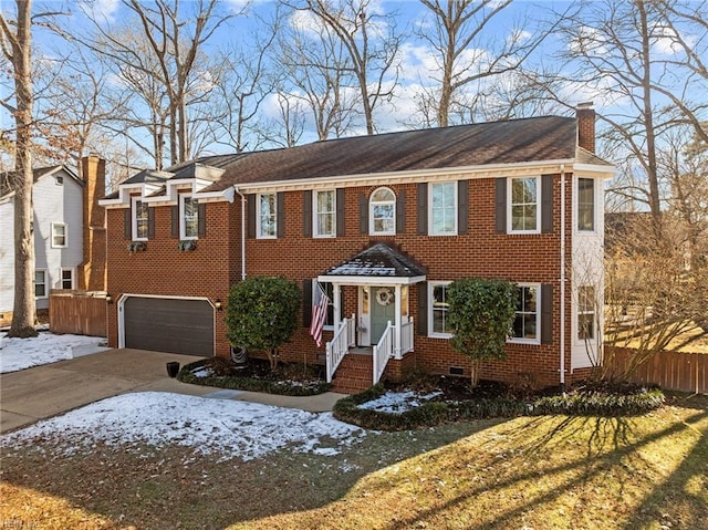 view of front of home with a garage and a front lawn