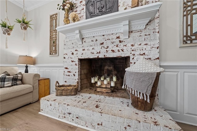 details with a brick fireplace, hardwood / wood-style floors, and crown molding