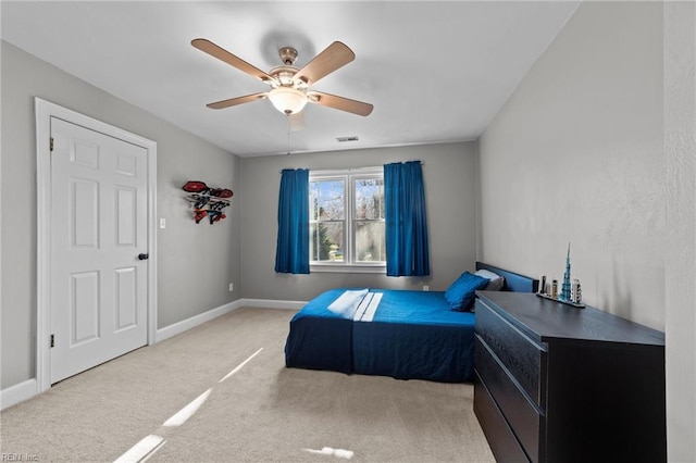 bedroom featuring ceiling fan and carpet