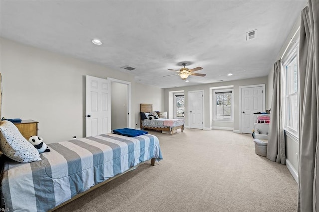 carpeted bedroom with ceiling fan