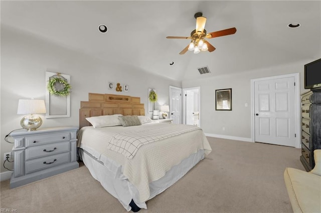 bedroom with lofted ceiling, ceiling fan, and light colored carpet