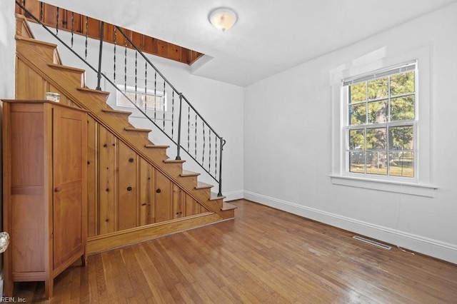 staircase featuring hardwood / wood-style floors