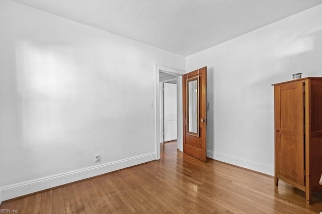 unfurnished room with light hardwood / wood-style flooring