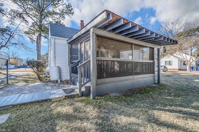 view of property exterior featuring a yard