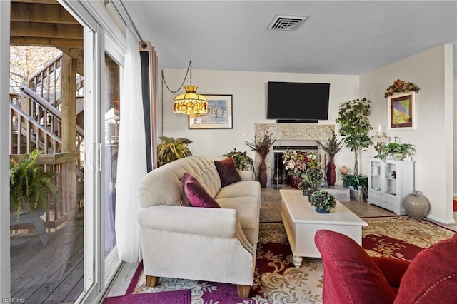 living room featuring a high end fireplace