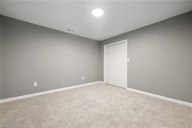 empty room with light colored carpet