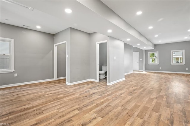 unfurnished living room with light hardwood / wood-style floors