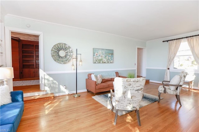 living room featuring ornamental molding and wood-type flooring