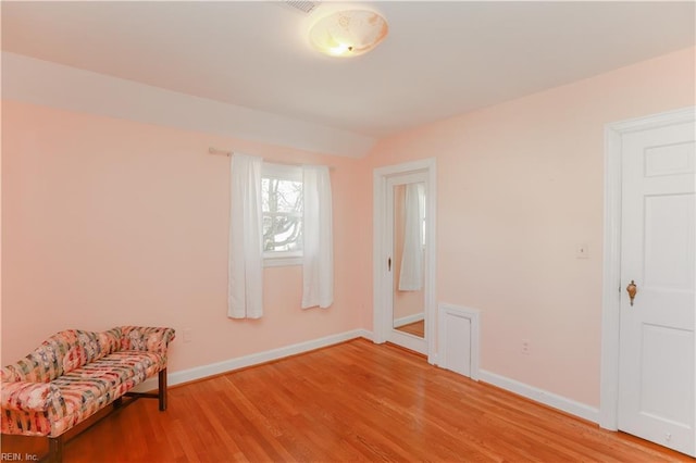 living area featuring hardwood / wood-style floors