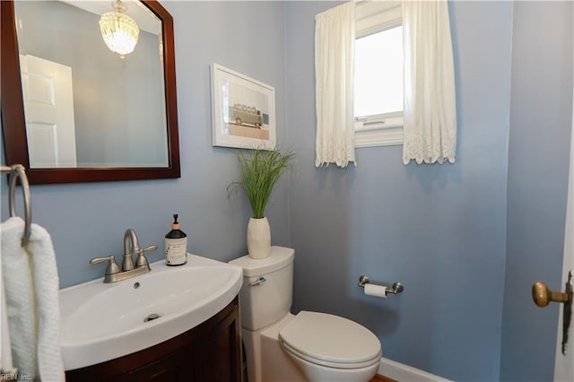 bathroom featuring vanity and toilet