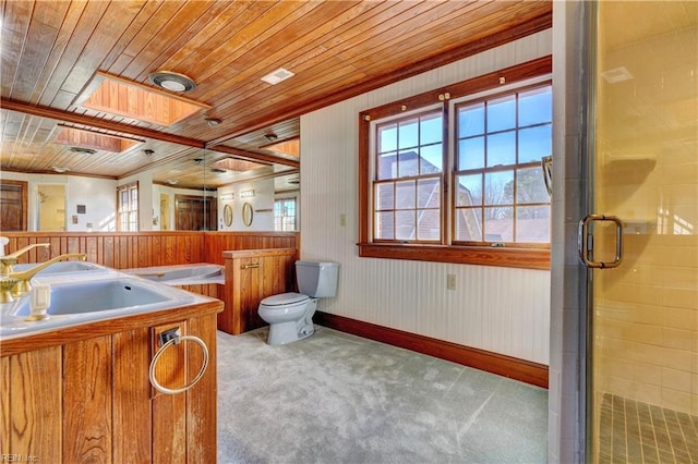 bathroom featuring wooden ceiling, toilet, a skylight, vanity, and a shower with door