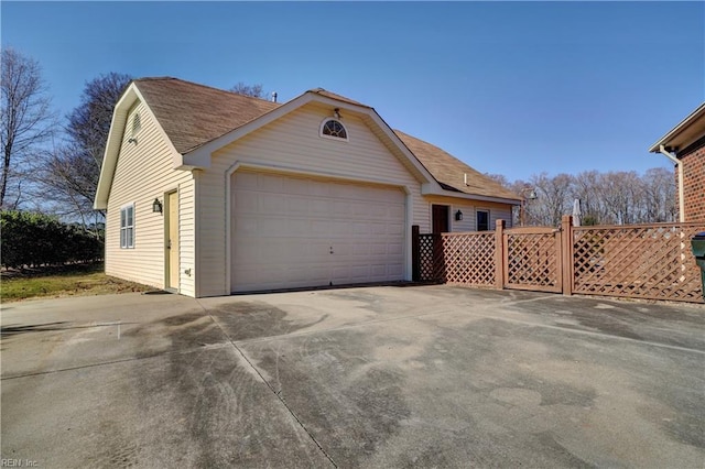 view of side of home with a garage