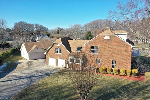 view of front of home featuring a garage and a front lawn