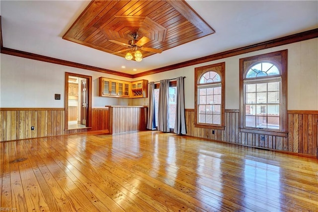 unfurnished living room featuring ceiling fan, light hardwood / wood-style floors, and crown molding