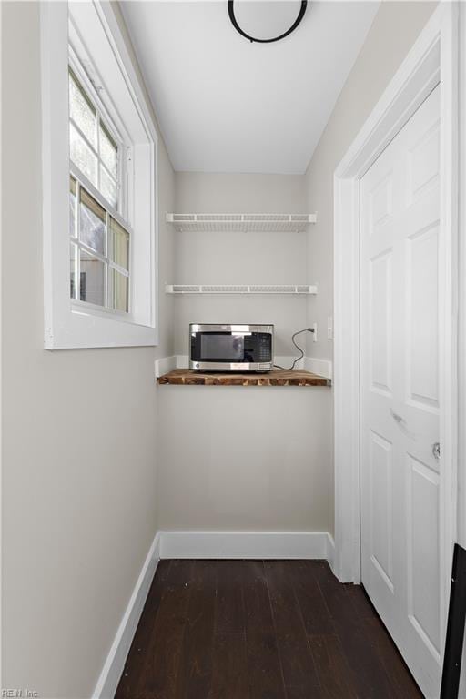 interior space with wooden counters and dark hardwood / wood-style flooring