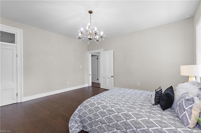 bedroom with dark wood-type flooring and a chandelier