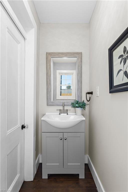 bathroom with vanity and hardwood / wood-style flooring