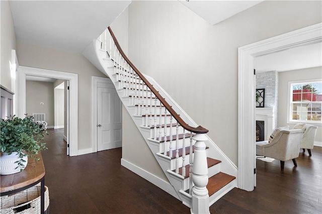 stairs featuring hardwood / wood-style floors