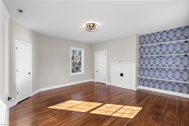 empty room with dark wood-type flooring