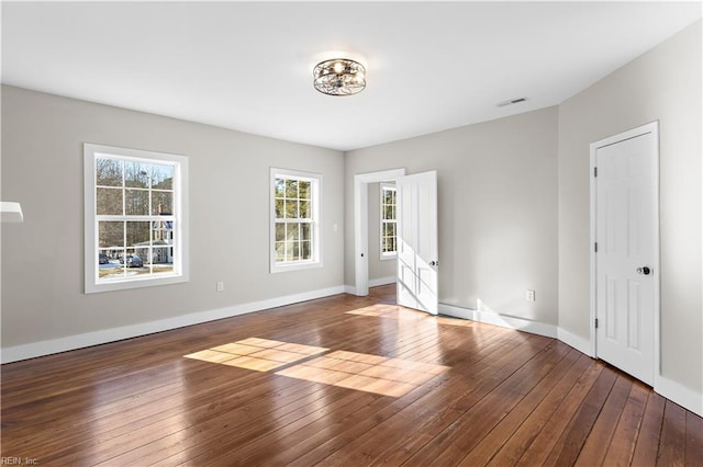 empty room featuring wood-type flooring