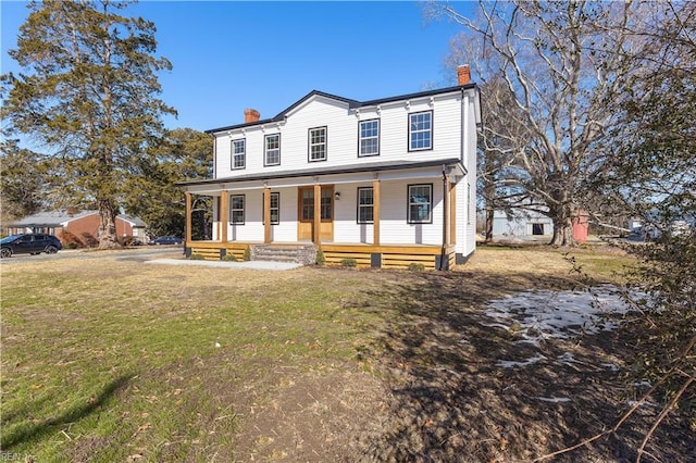 view of front of property featuring a porch and a front yard