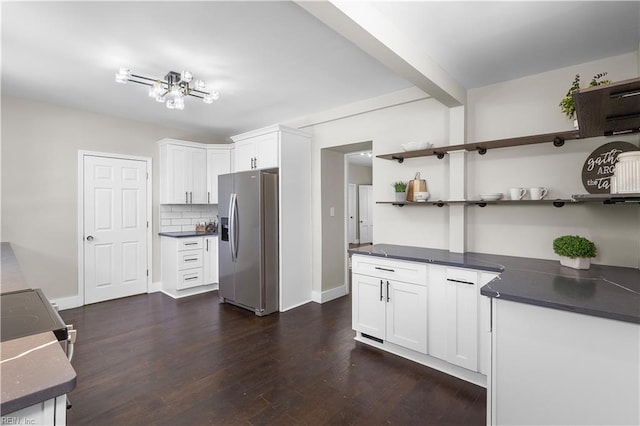 kitchen with stainless steel appliances, white cabinets, decorative backsplash, and dark wood-type flooring