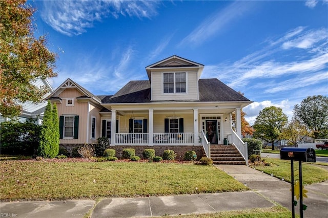 view of front of house with a porch and a front lawn