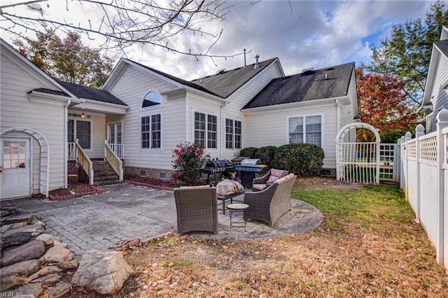 back of house with outdoor lounge area and a patio