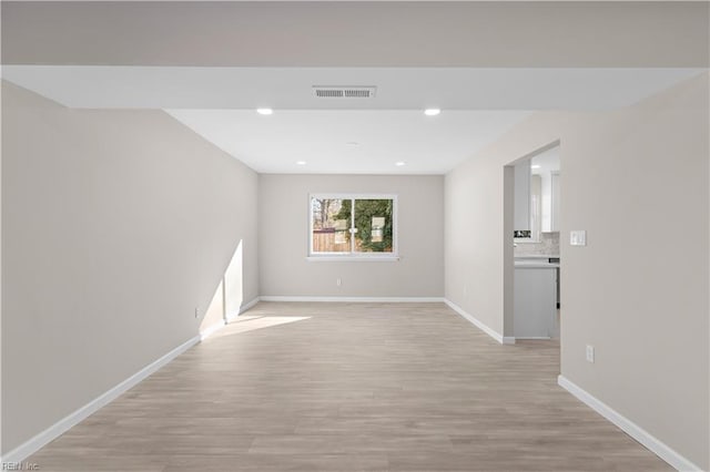 spare room with light wood-type flooring