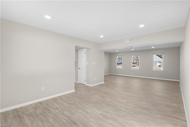 empty room with light hardwood / wood-style floors