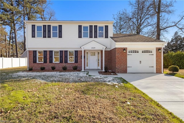 view of front of house with a front lawn and a garage