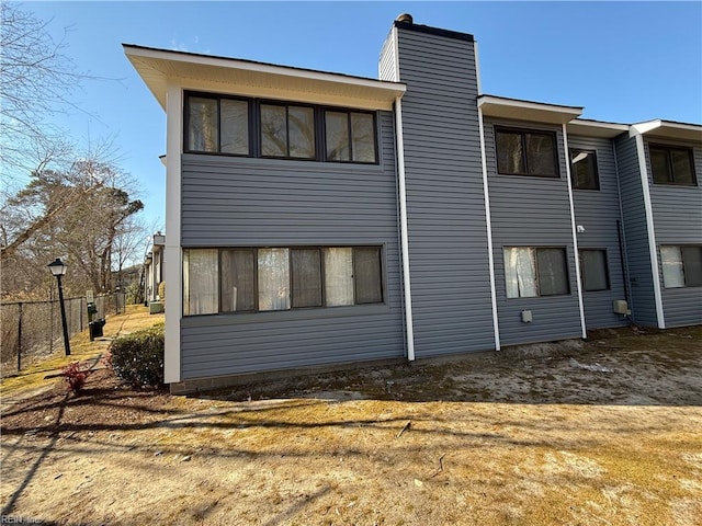 rear view of property with a yard